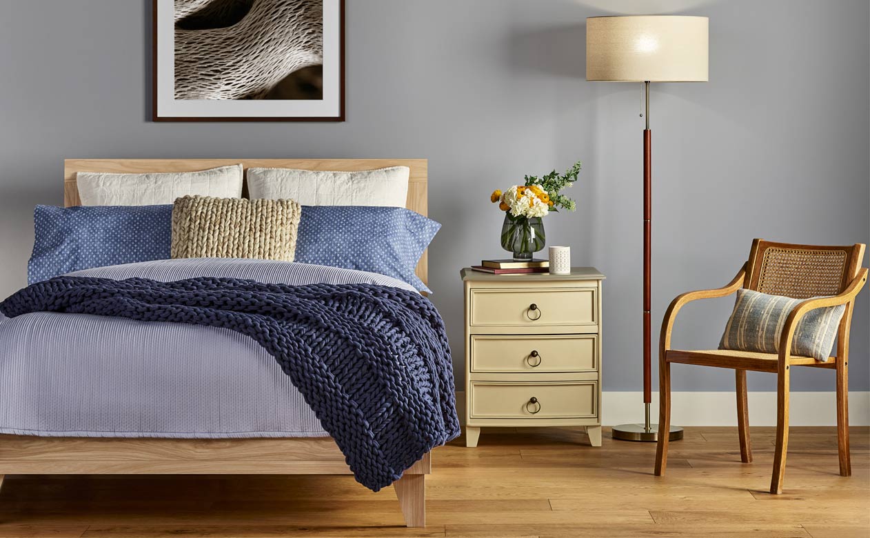 Bedroom with new oak hardwood flooring from Baldwin's Flooring America