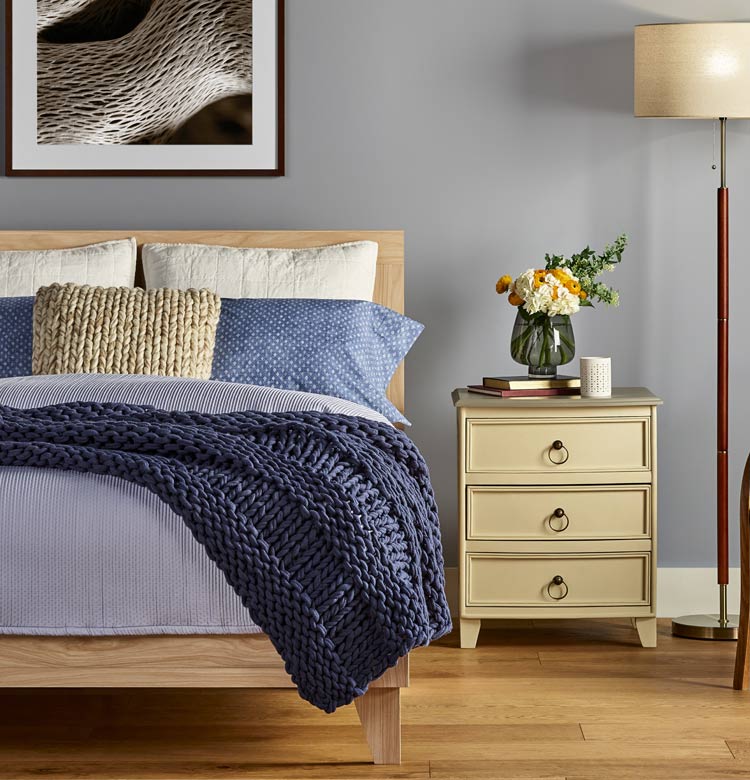 Bedroom with new oak hardwood flooring from Baldwin's Flooring America